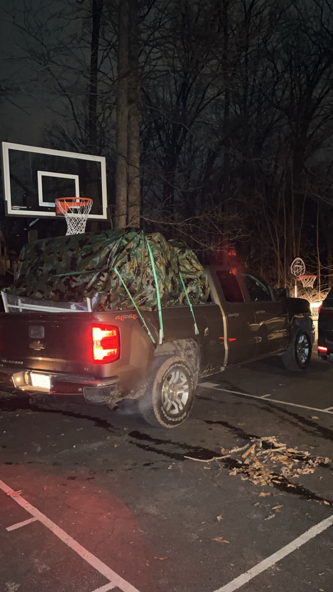 DMAC Junk Removal pickup truck loaded with hauled-away junk